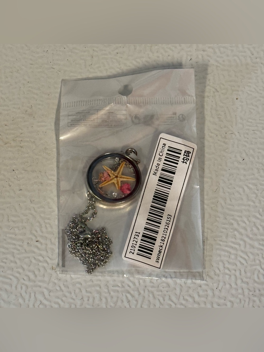 Silver Starfish Pendant Necklace with Pink Accents